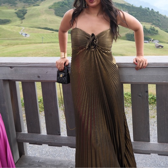 Mac Duggal Gold Metallic Pleated Gown with 3D Flower - Picture 2 of 4